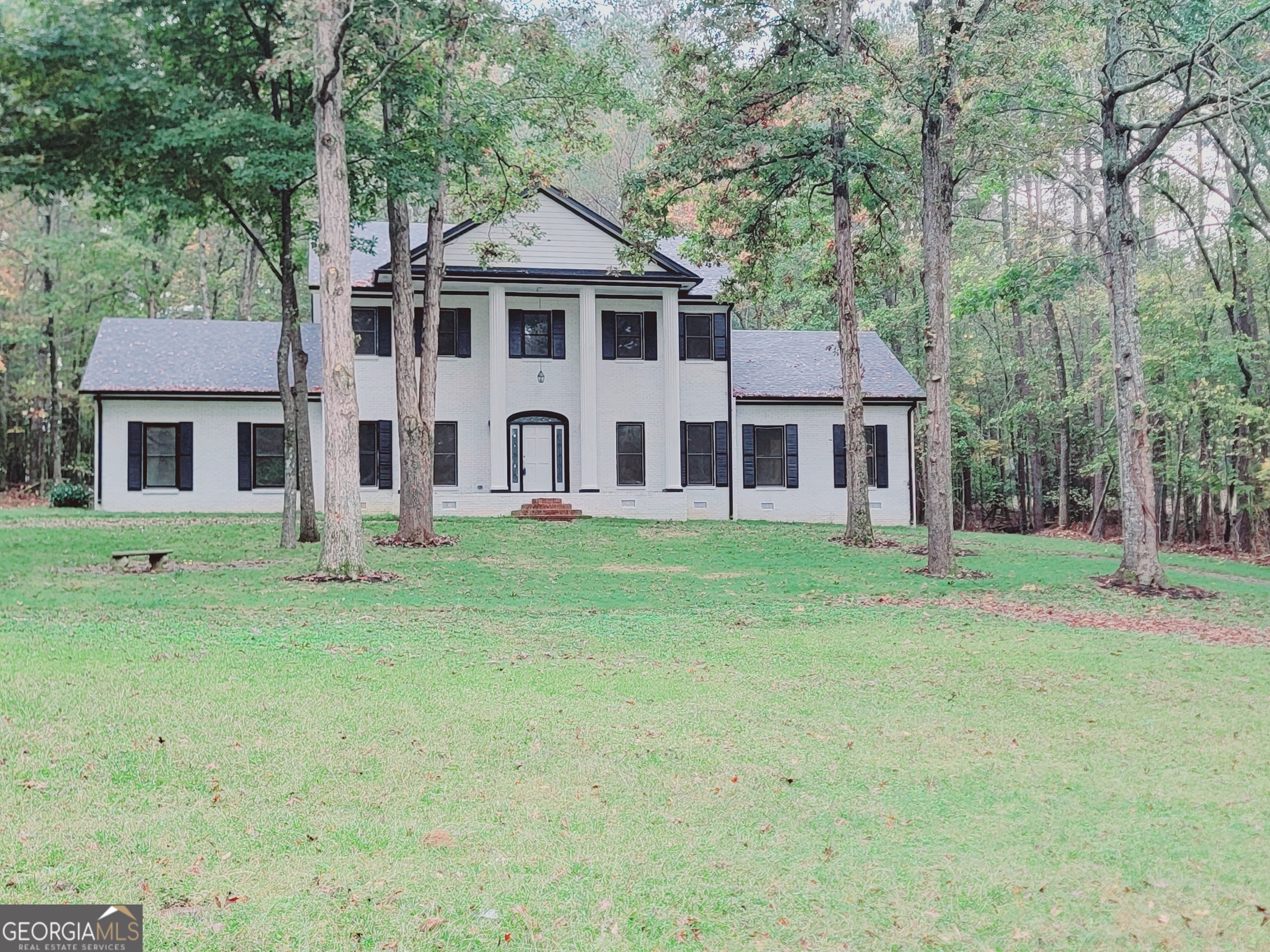 front view of a house with a yard