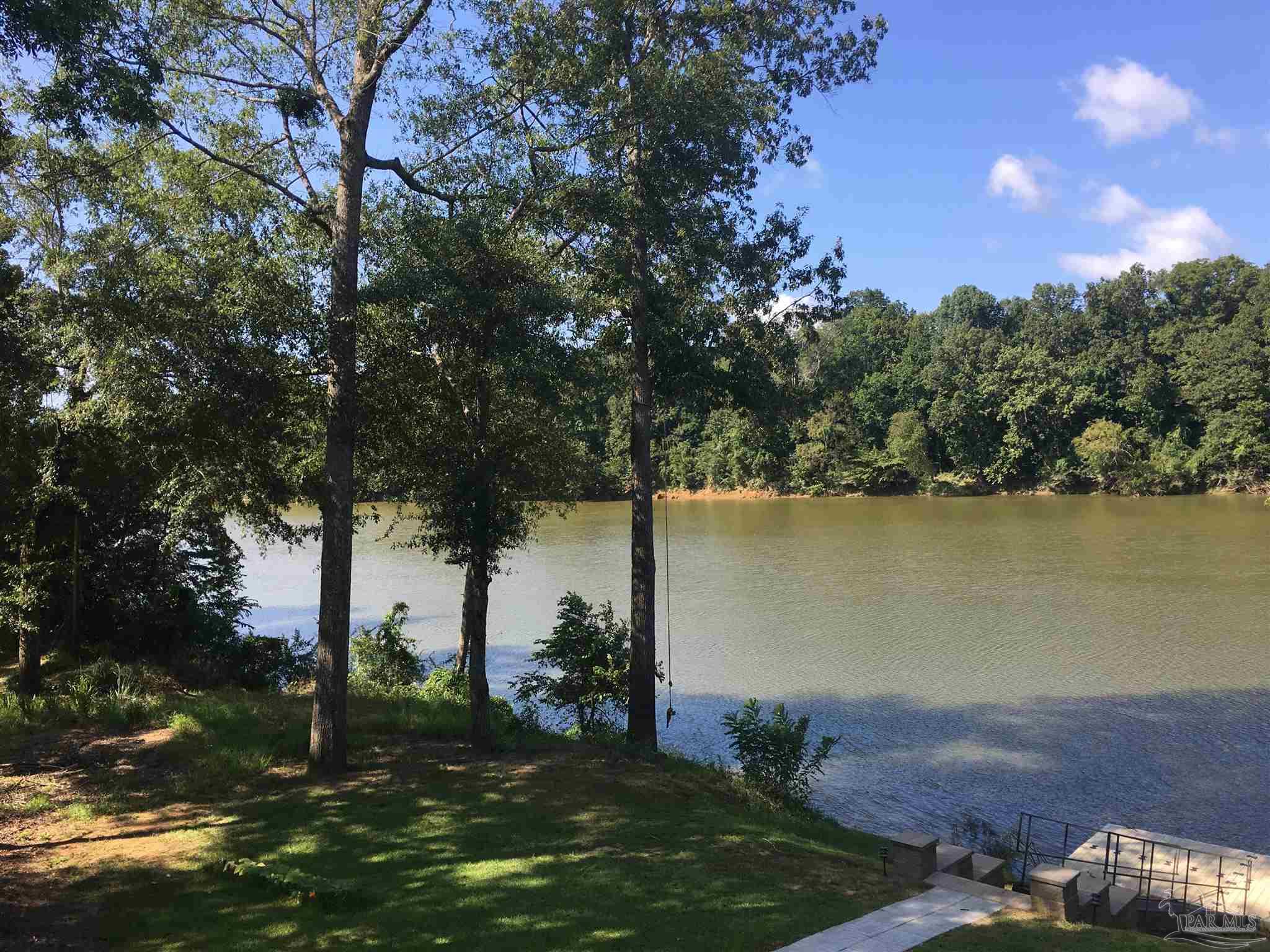 a view of a lake with a yard