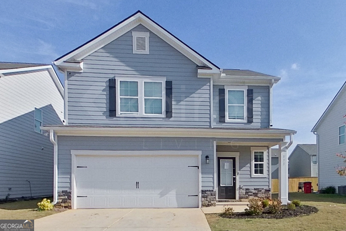 a front view of a house with parking