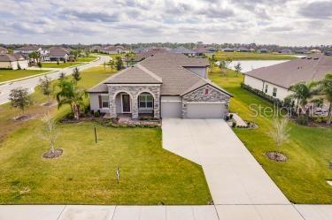 an aerial view of a house with a swimming pool