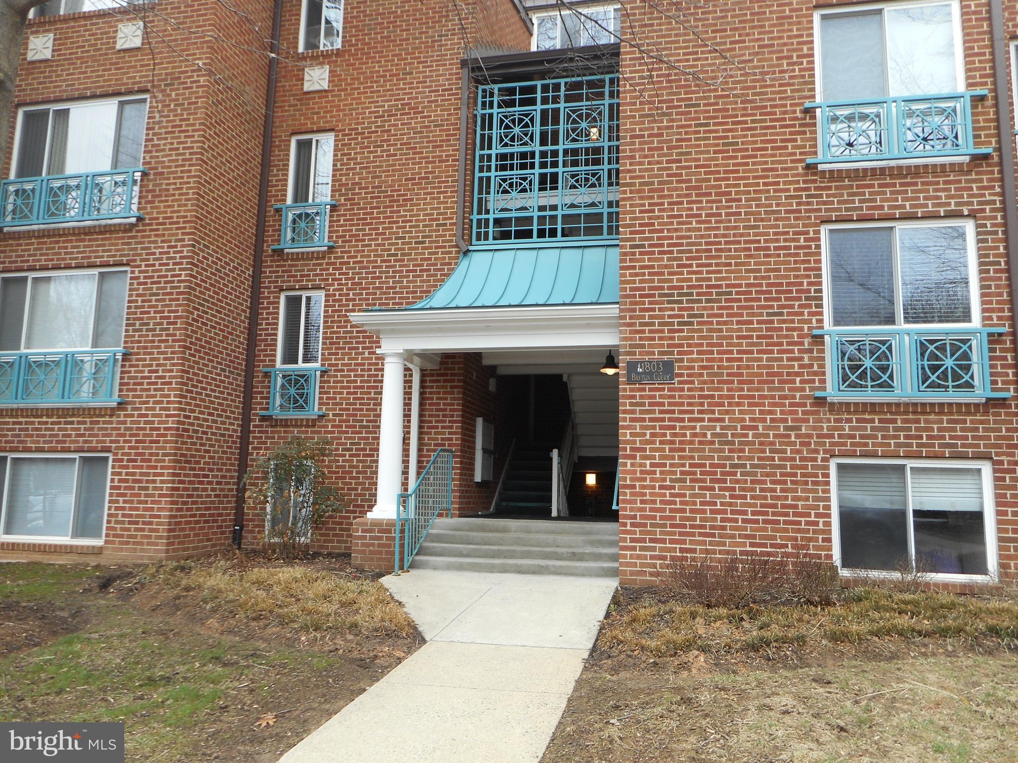 a view of a brick building with many windows