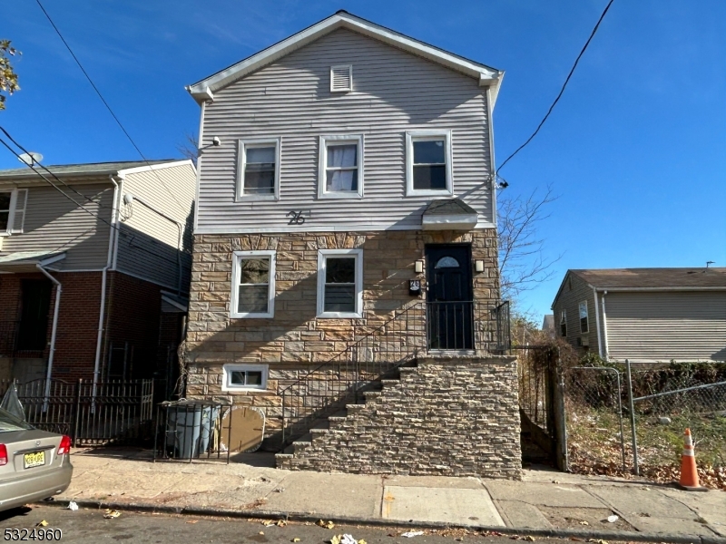 a front view of a house with glass windows