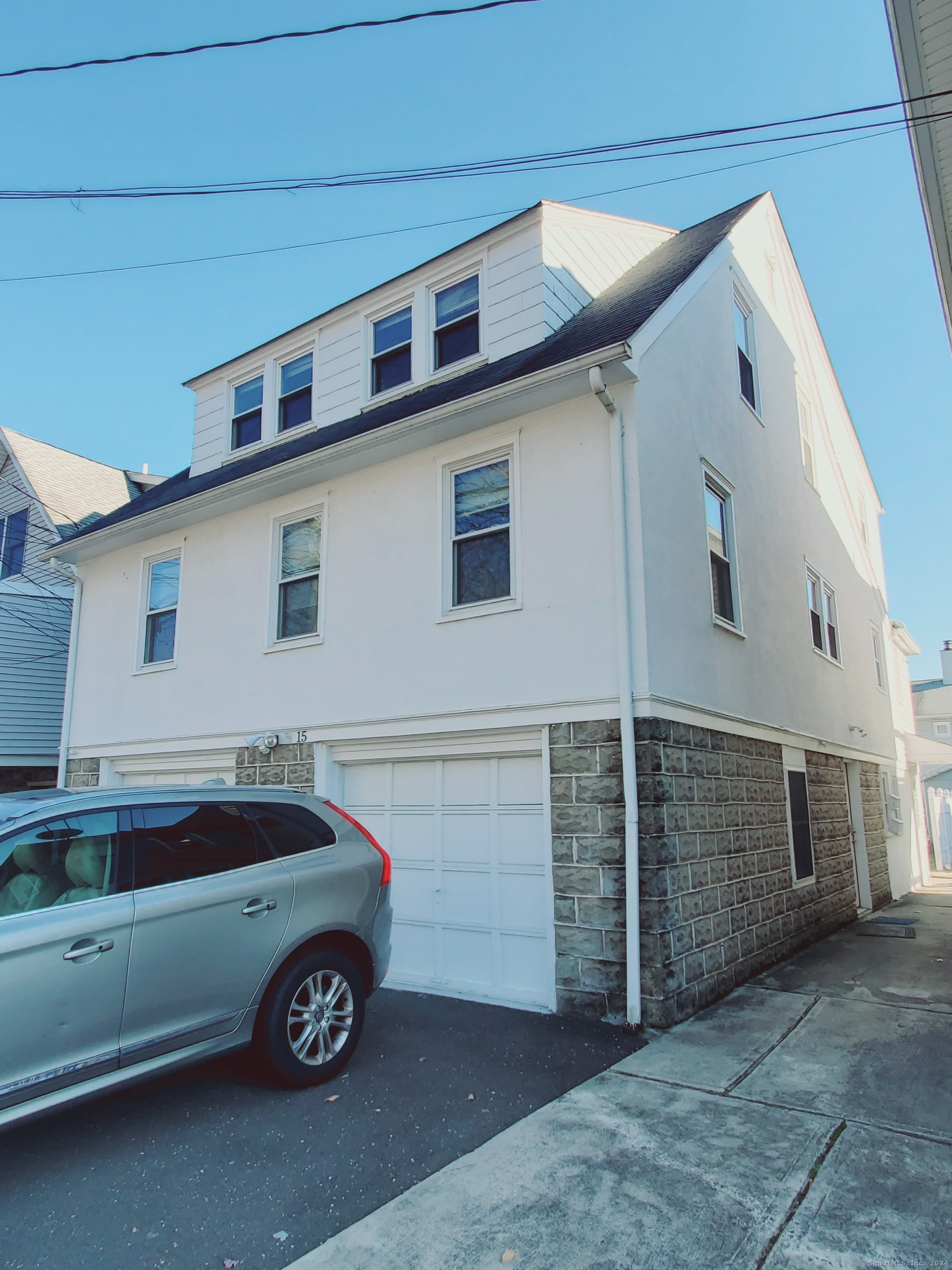 a car parked in front of a house