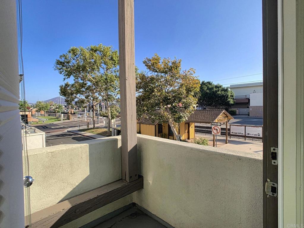 a view of a balcony with chairs