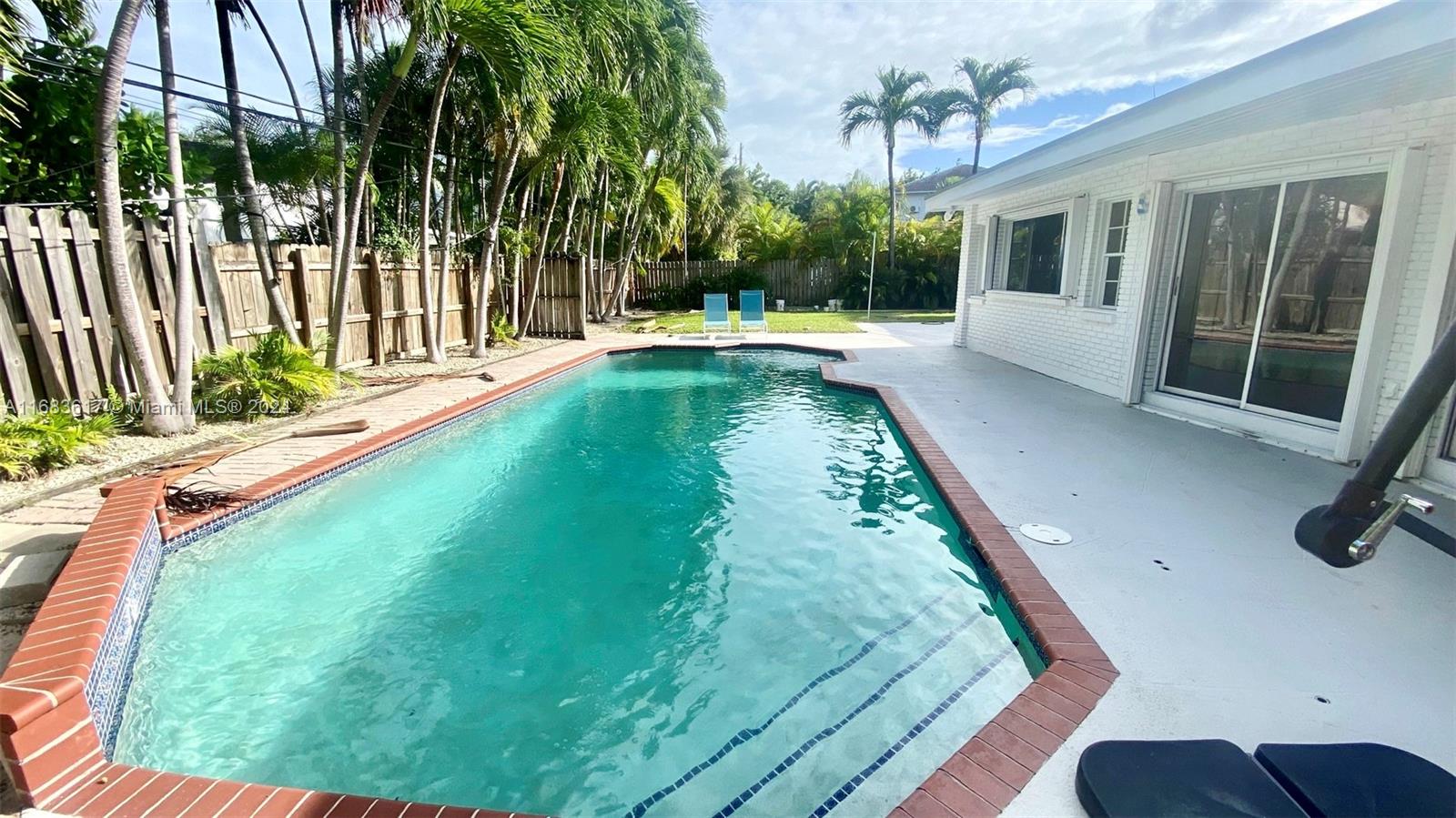 a view of a house with a swimming pool