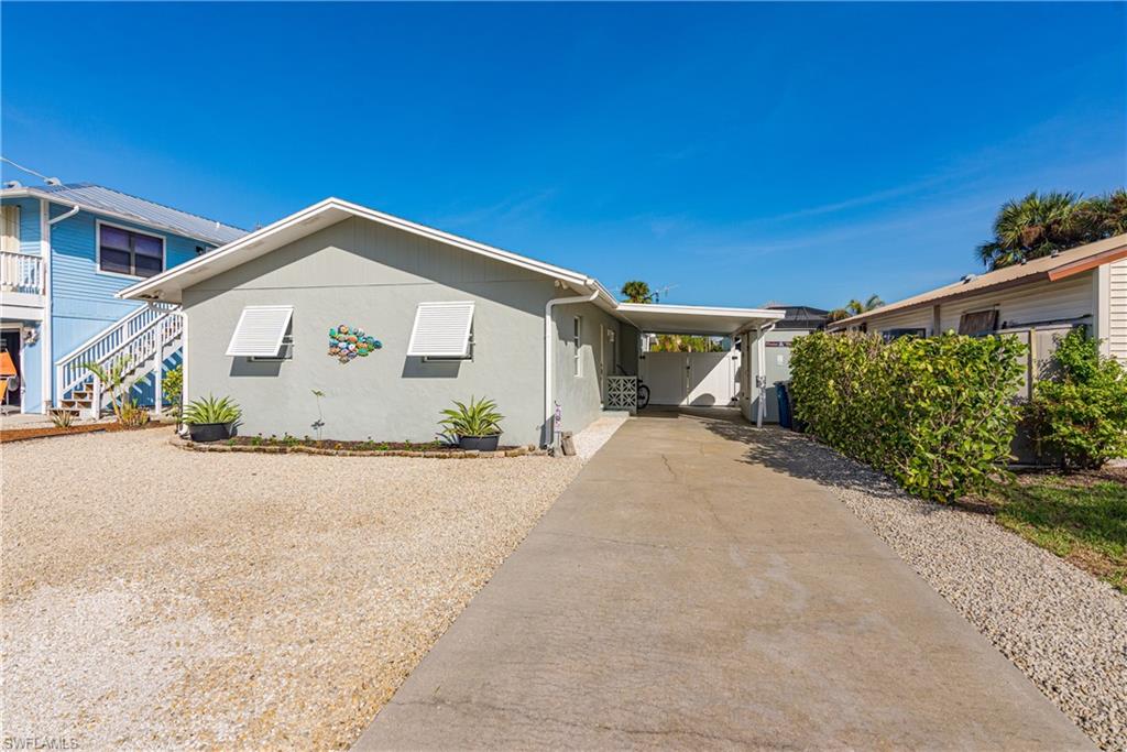 View of front of property with a carport