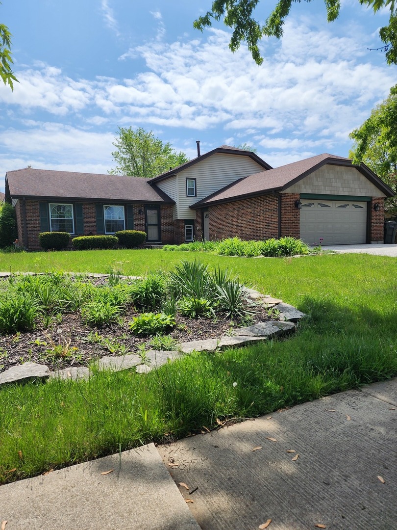 a house view with a garden space