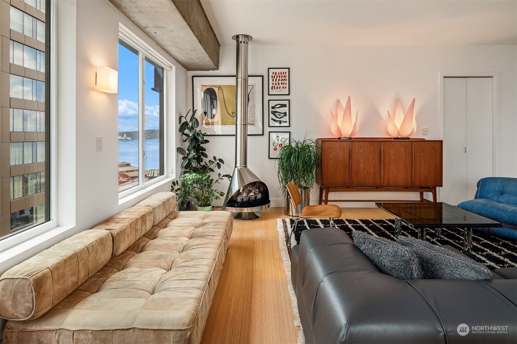 a living room with furniture and a potted plant