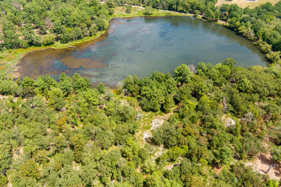 a view of a lake with a yard