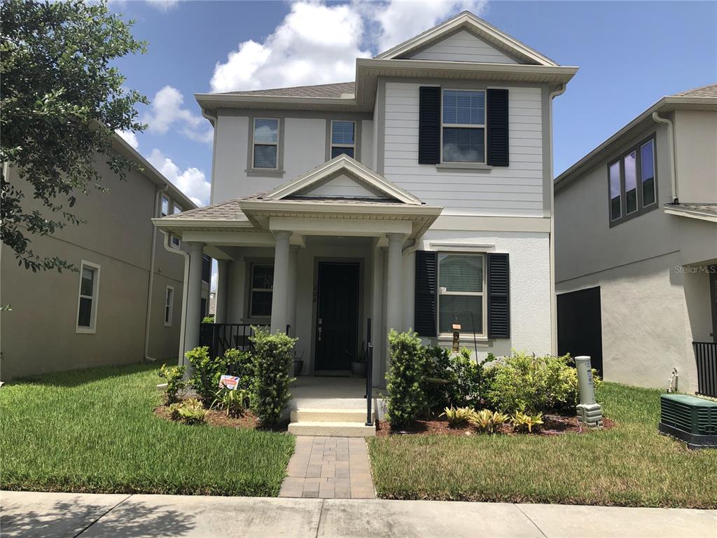 a front view of a house with a yard