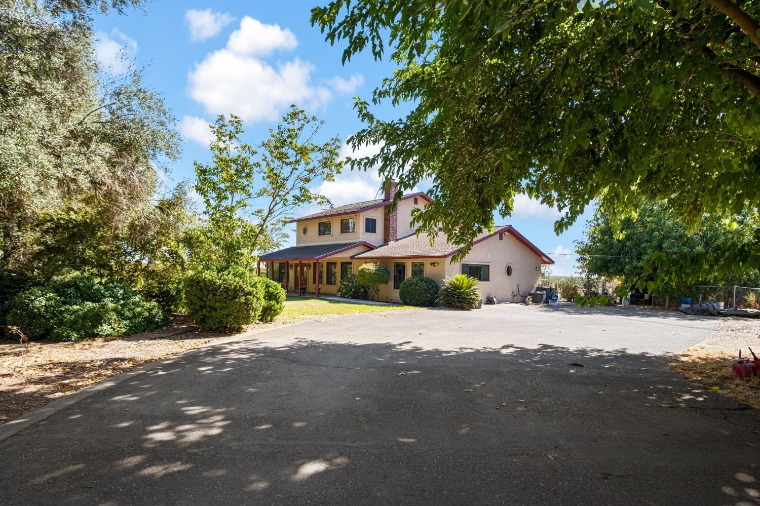 a house with a tree in front of it