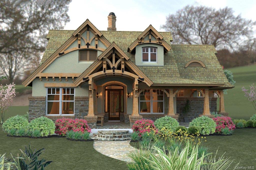 a front view of a house with a yard and potted plants