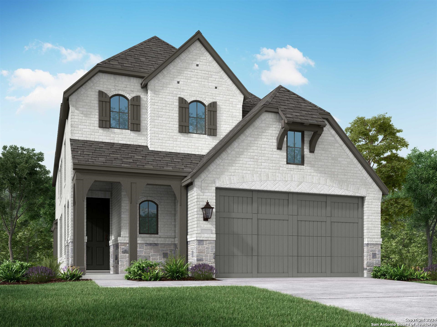 a front view of a house with a yard and garage