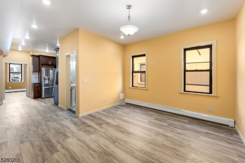 a view of livingroom with hardwood floor and hallway