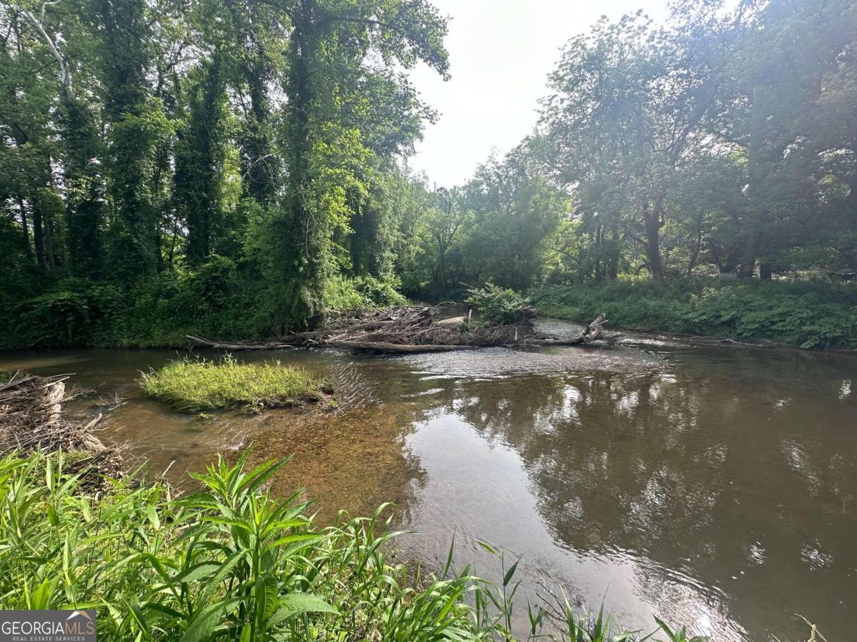 a view of a lake in between two of trees