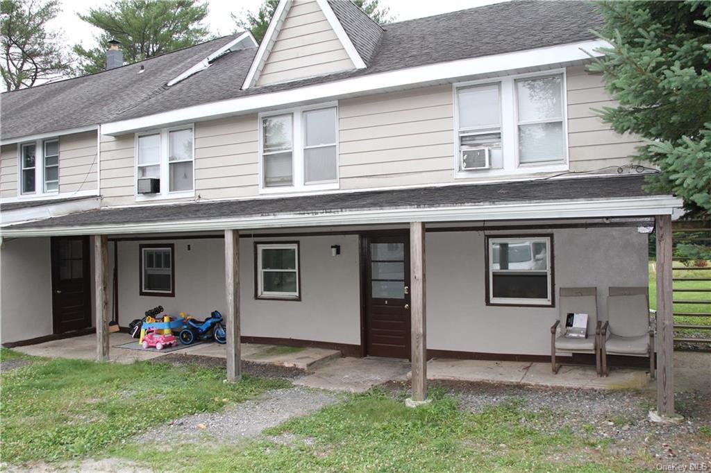 a view of a backyard of the house