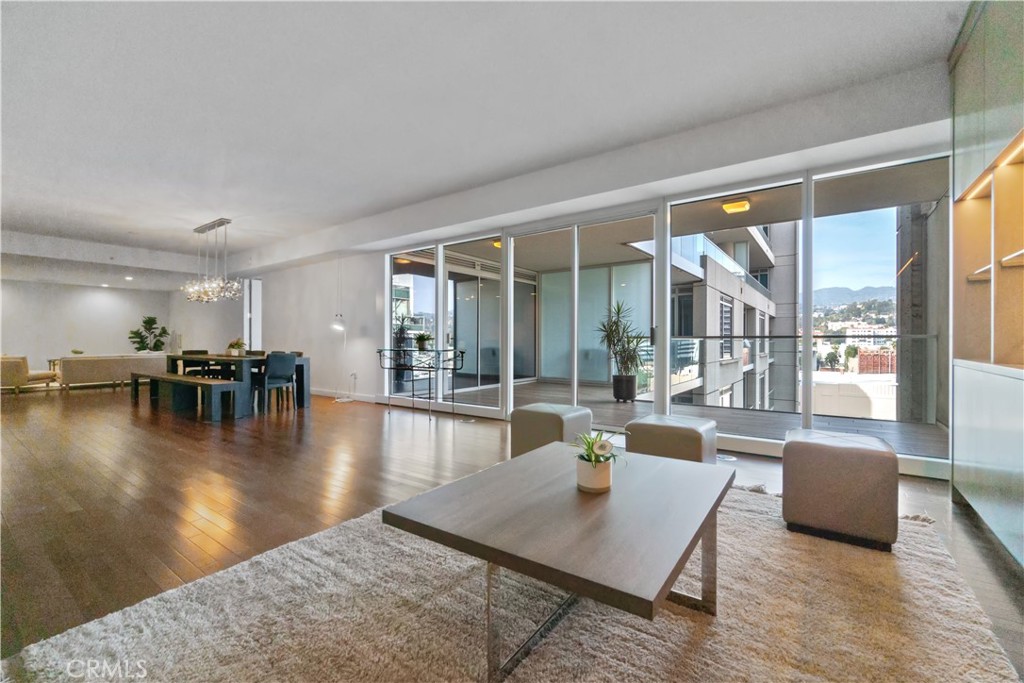 a lobby with furniture and floor to ceiling windows