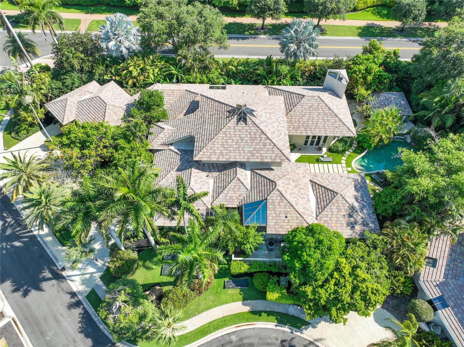 an aerial view of a house with a garden