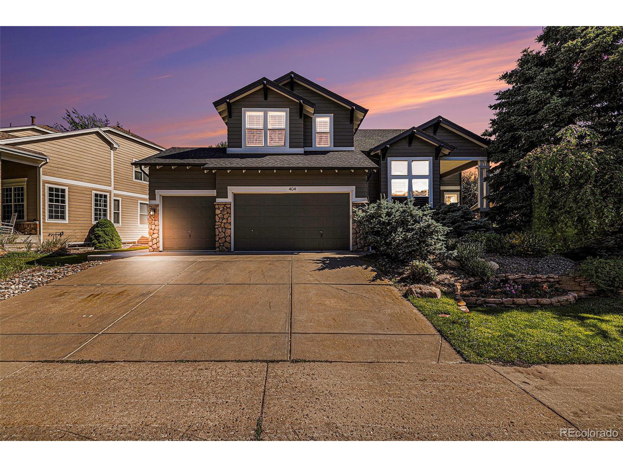 a front view of a house with yard