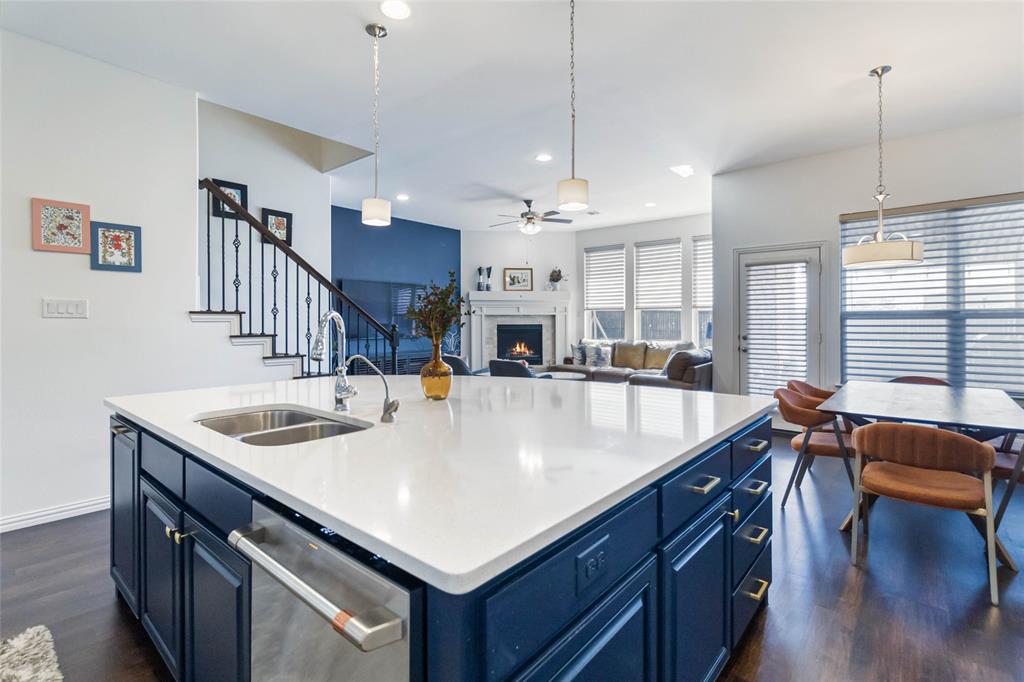 a view of kitchen island a sink and living room