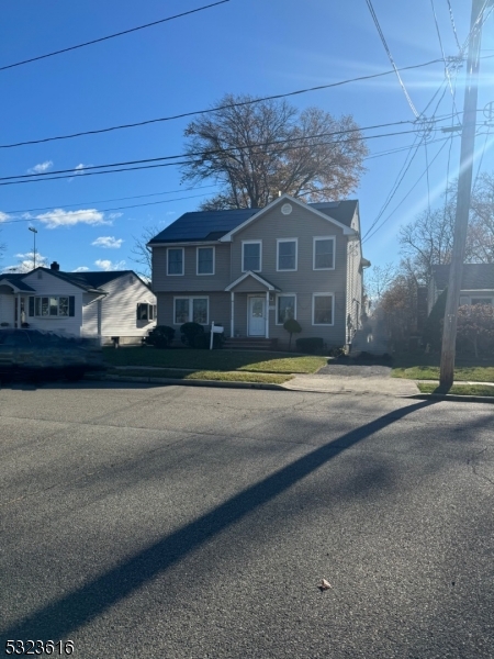 a view of a large house with a yard