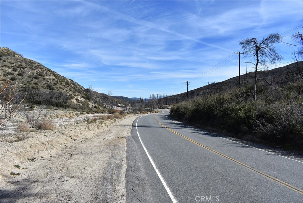 a view of a road with an ocean view