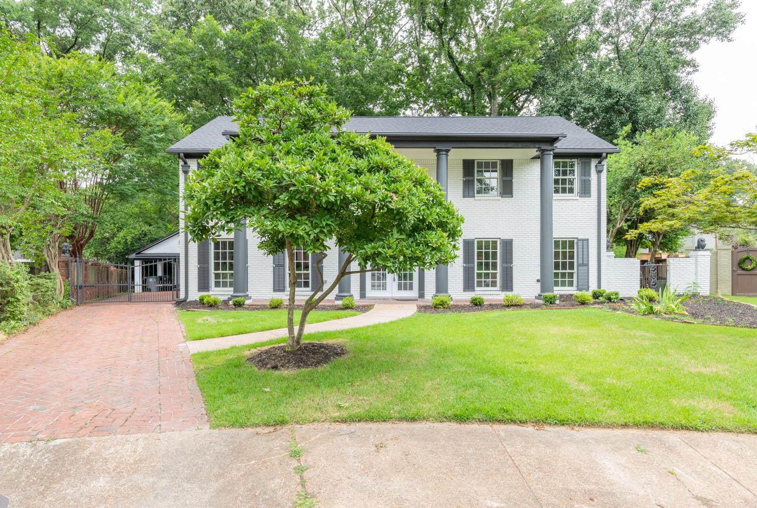 View of front of property with a front lawn