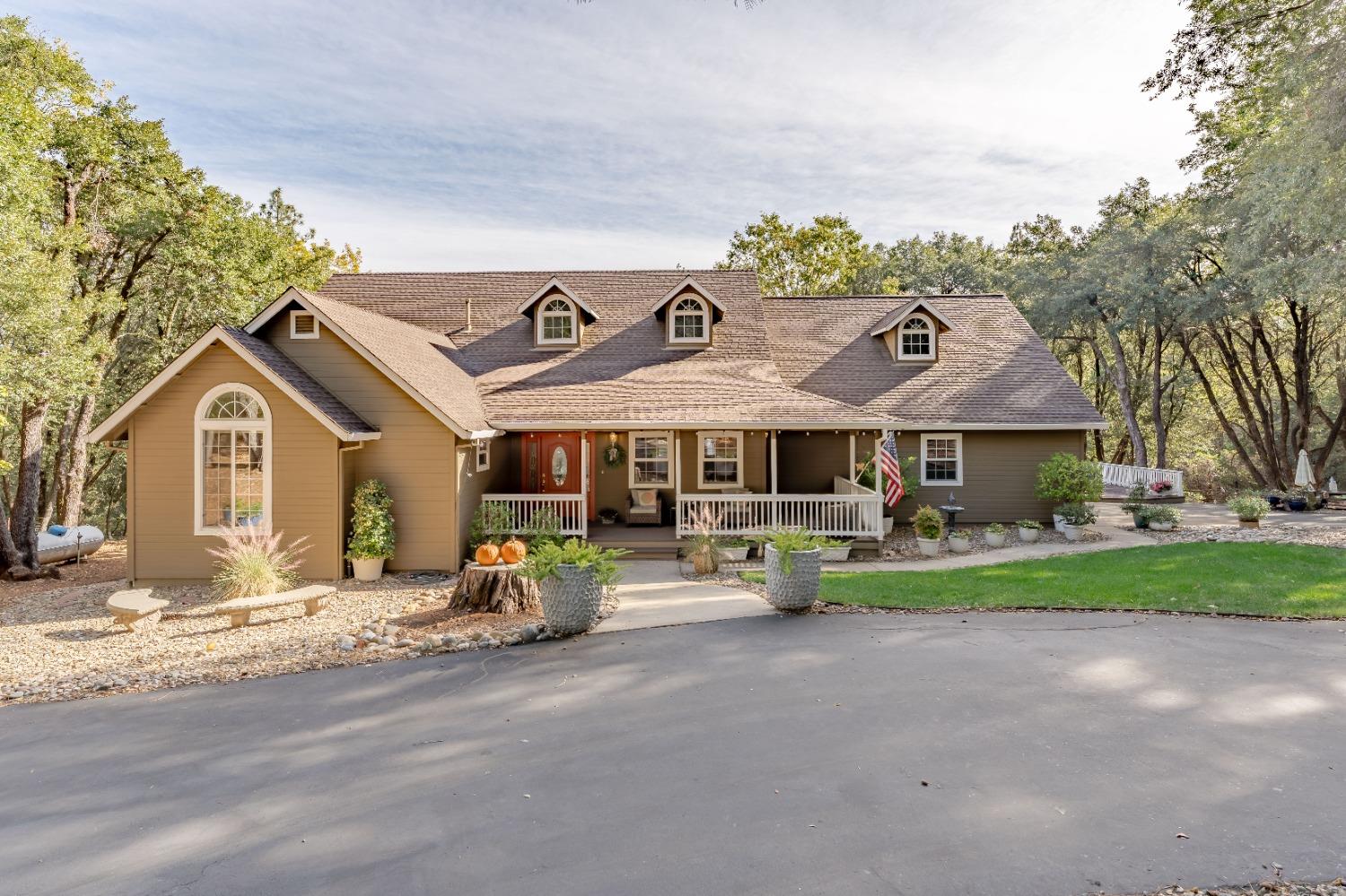 a front view of a house with garden