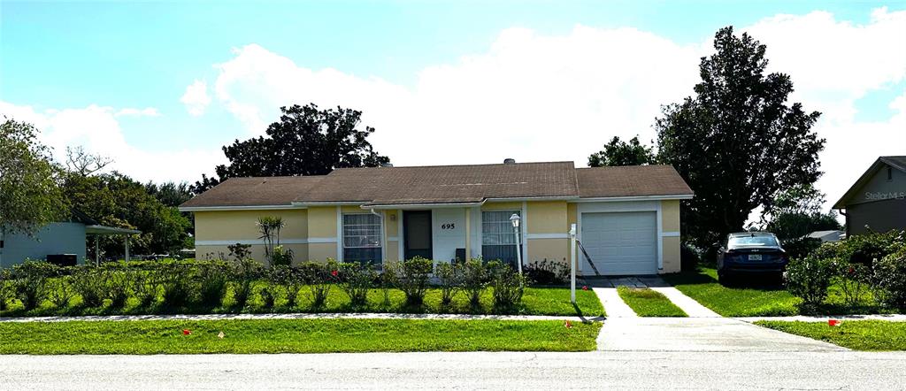 a view of outdoor space yard and garage