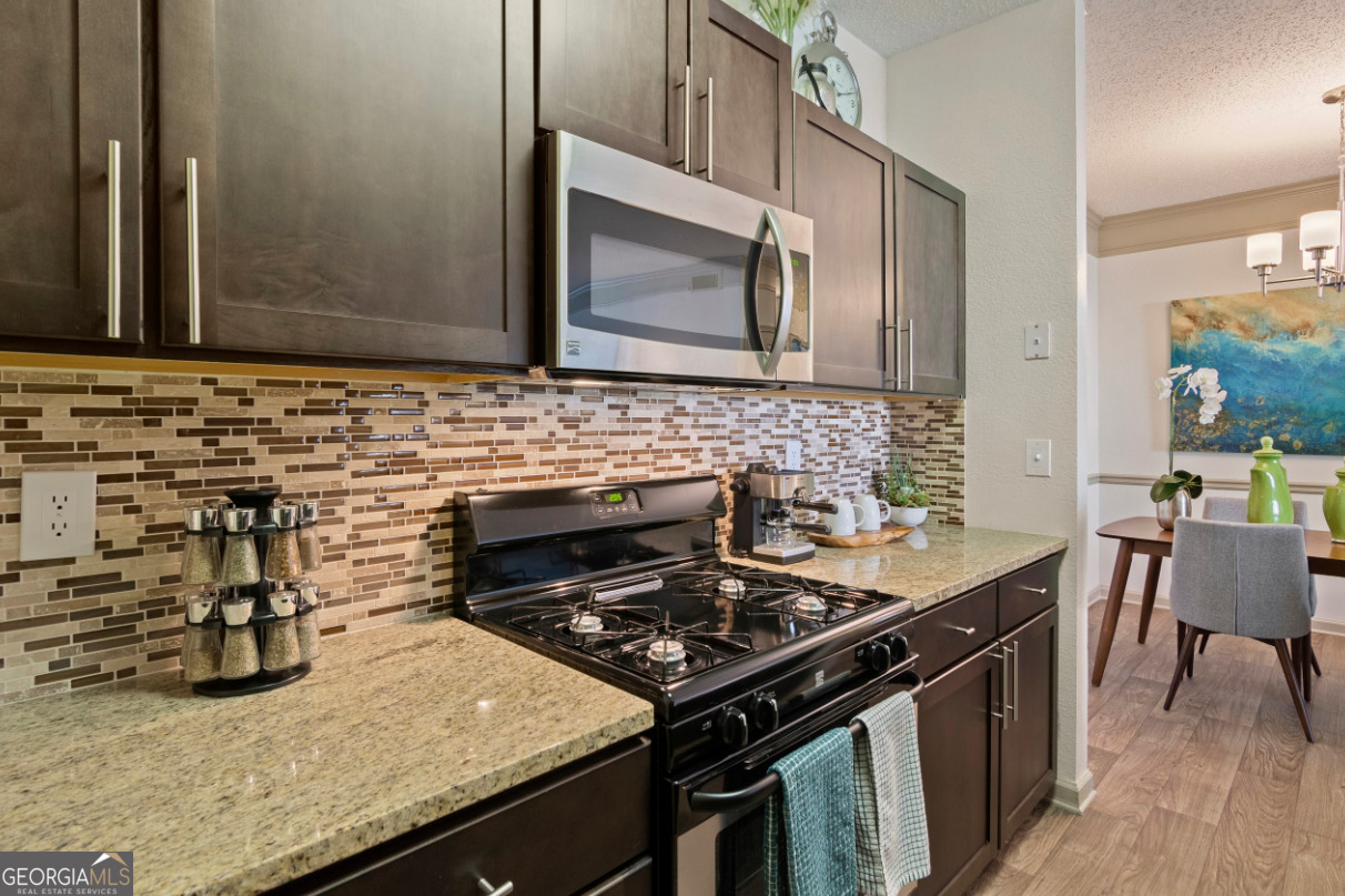 a kitchen with a stove and a microwave