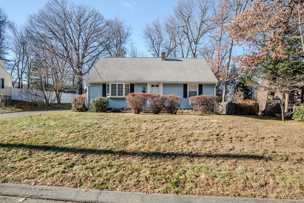 a view of a house with a yard covered in snow