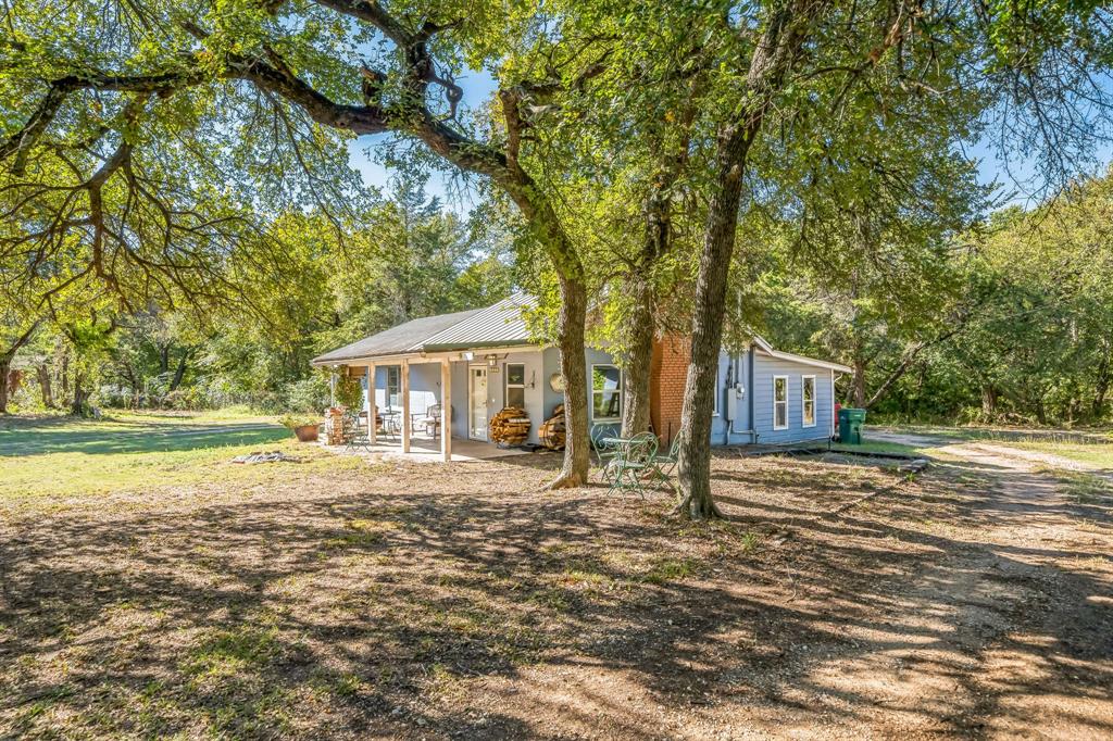 a house with trees in front of it