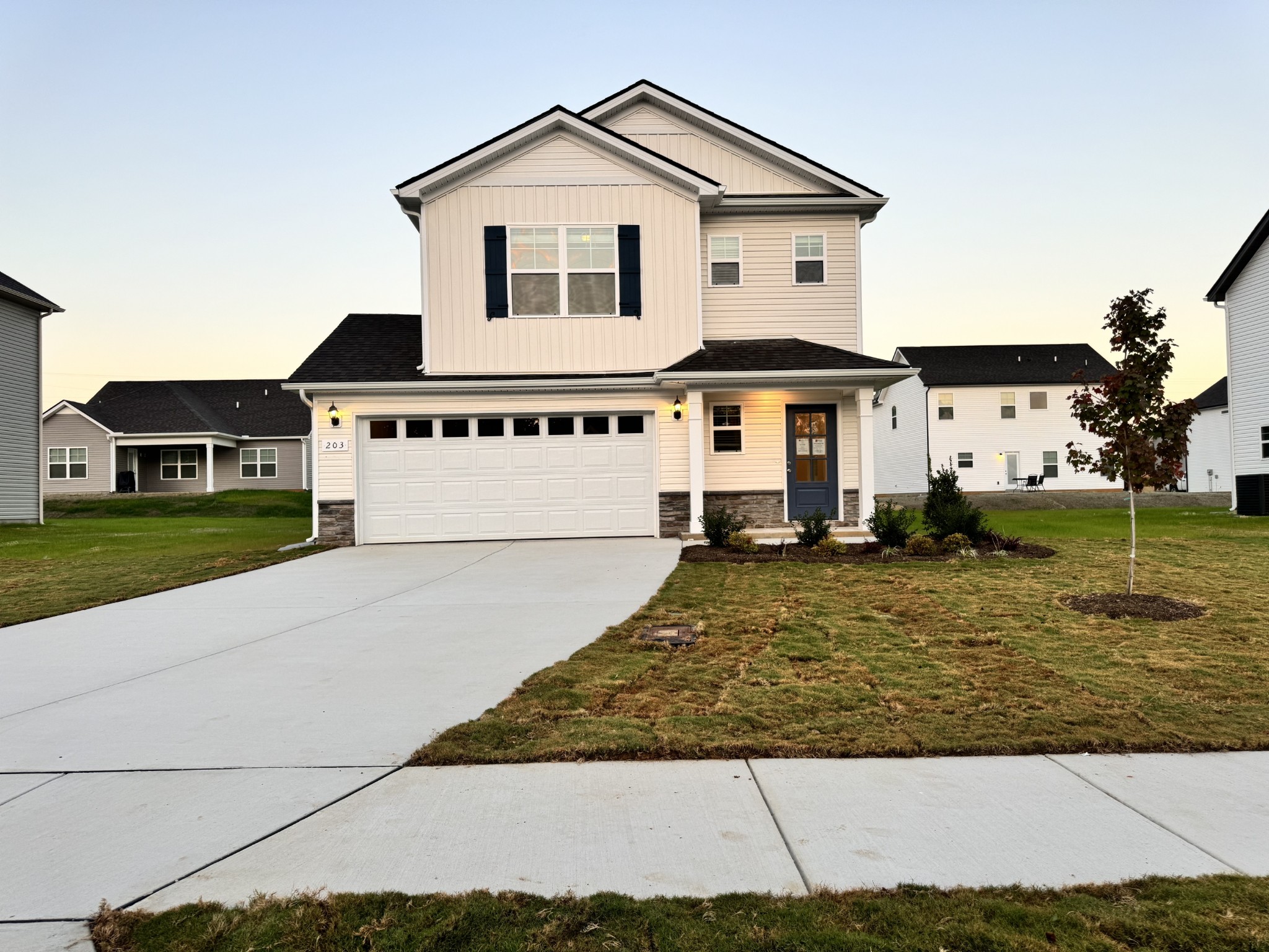 a front view of a house with a yard