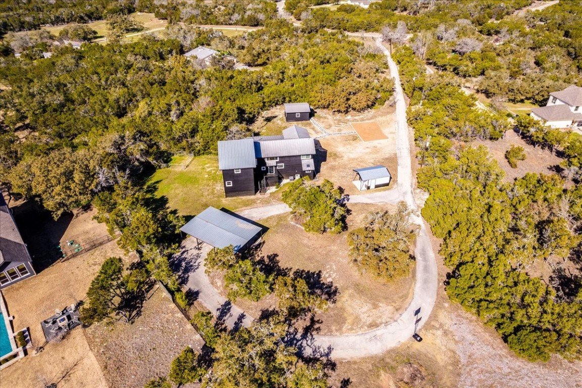 an aerial view of a house with a yard