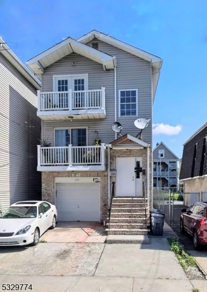 a front view of a house with parking space