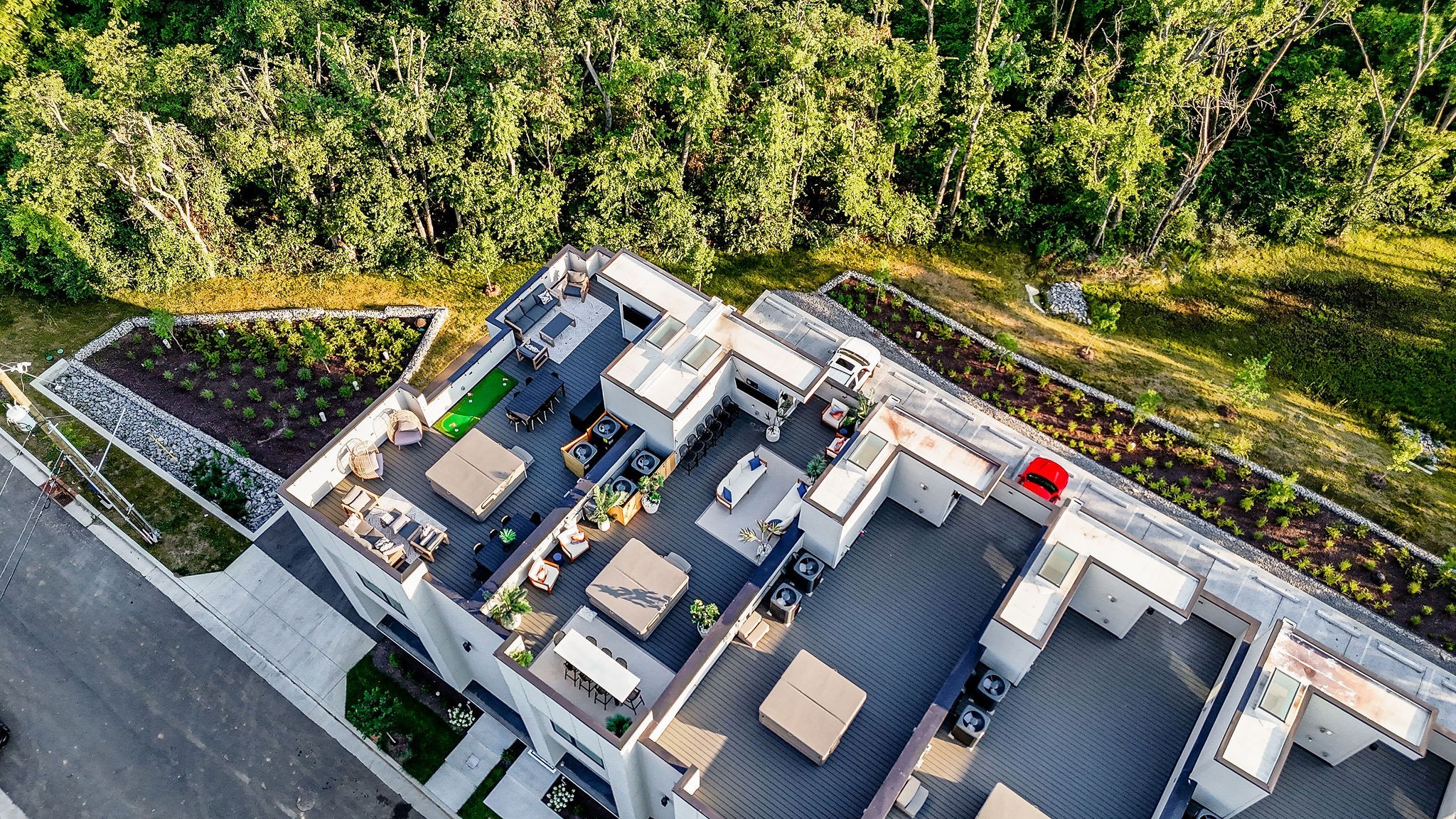 an aerial view of a residential apartment building with a yard