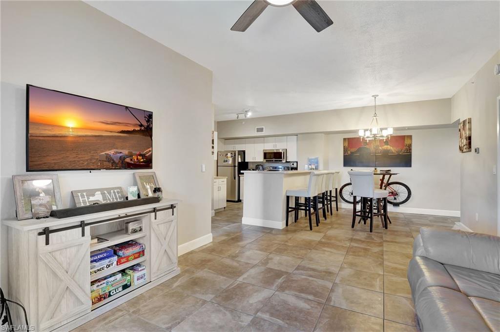 a living room with lots of furniture and a flat screen tv