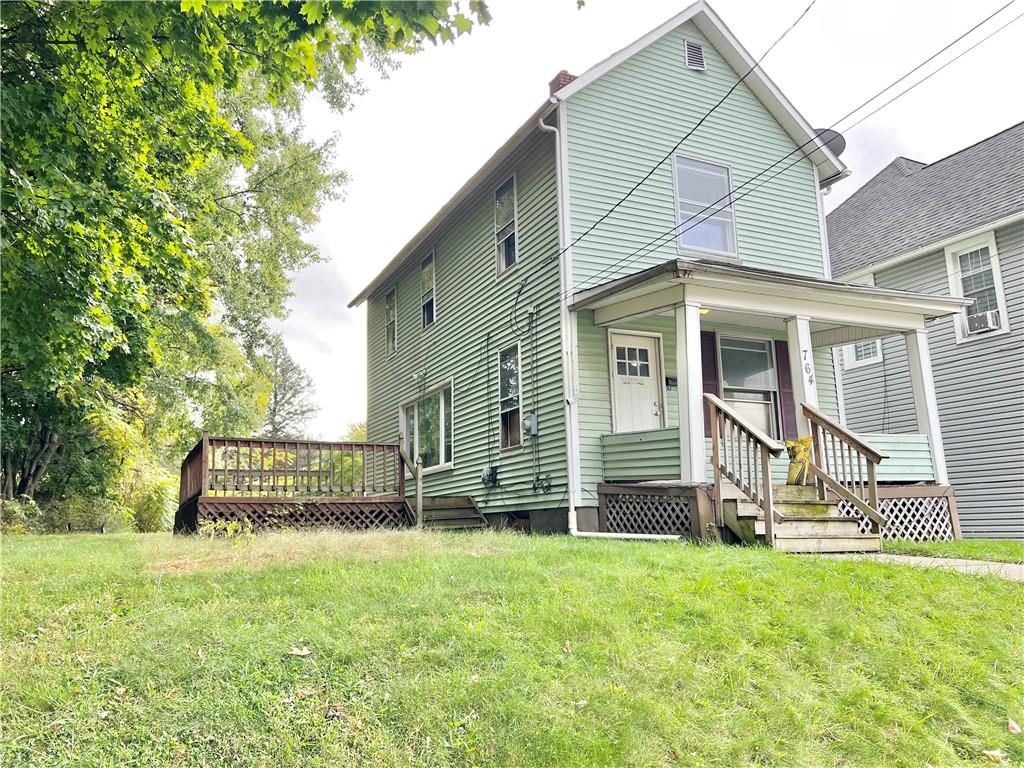 front view of a house with a yard