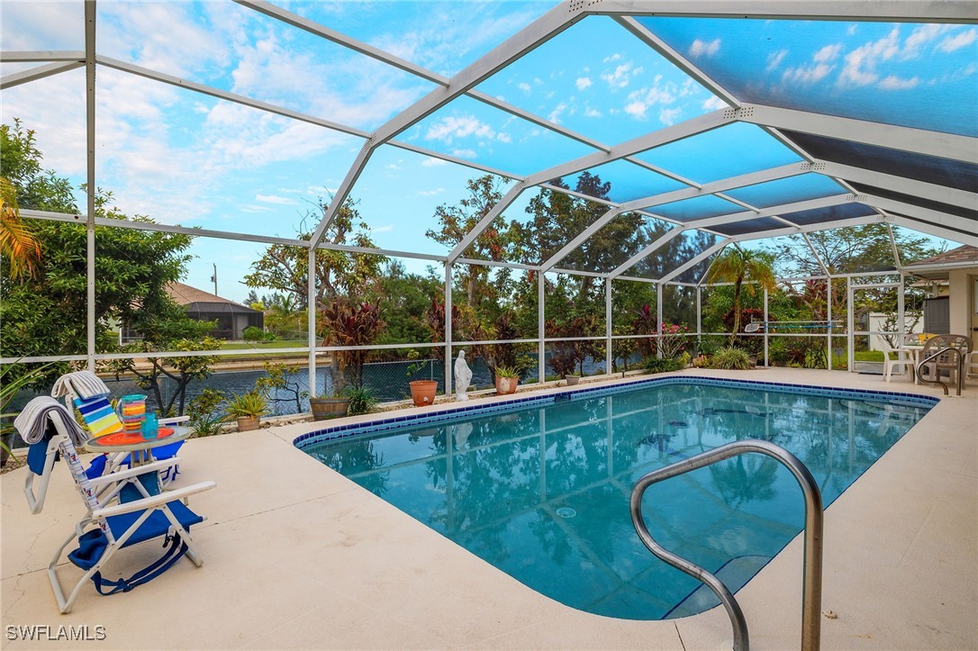 a view of a swimming pool with a lounge chairs