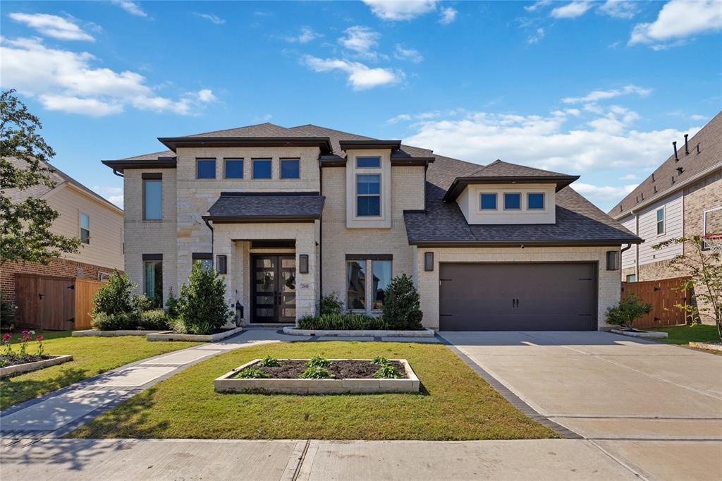 a view of house with yard and entertaining space