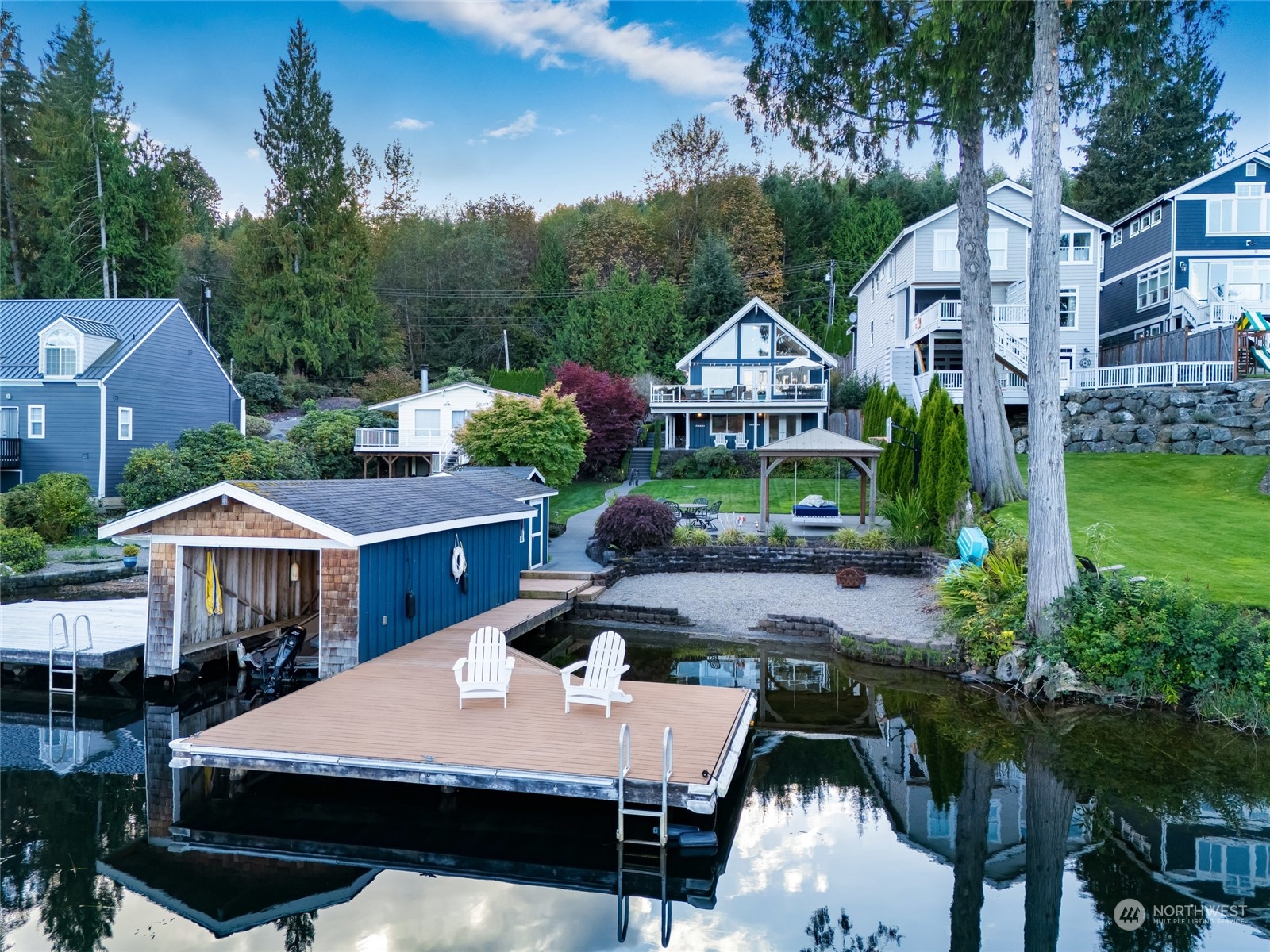 a aerial view of a house with yard and furniture