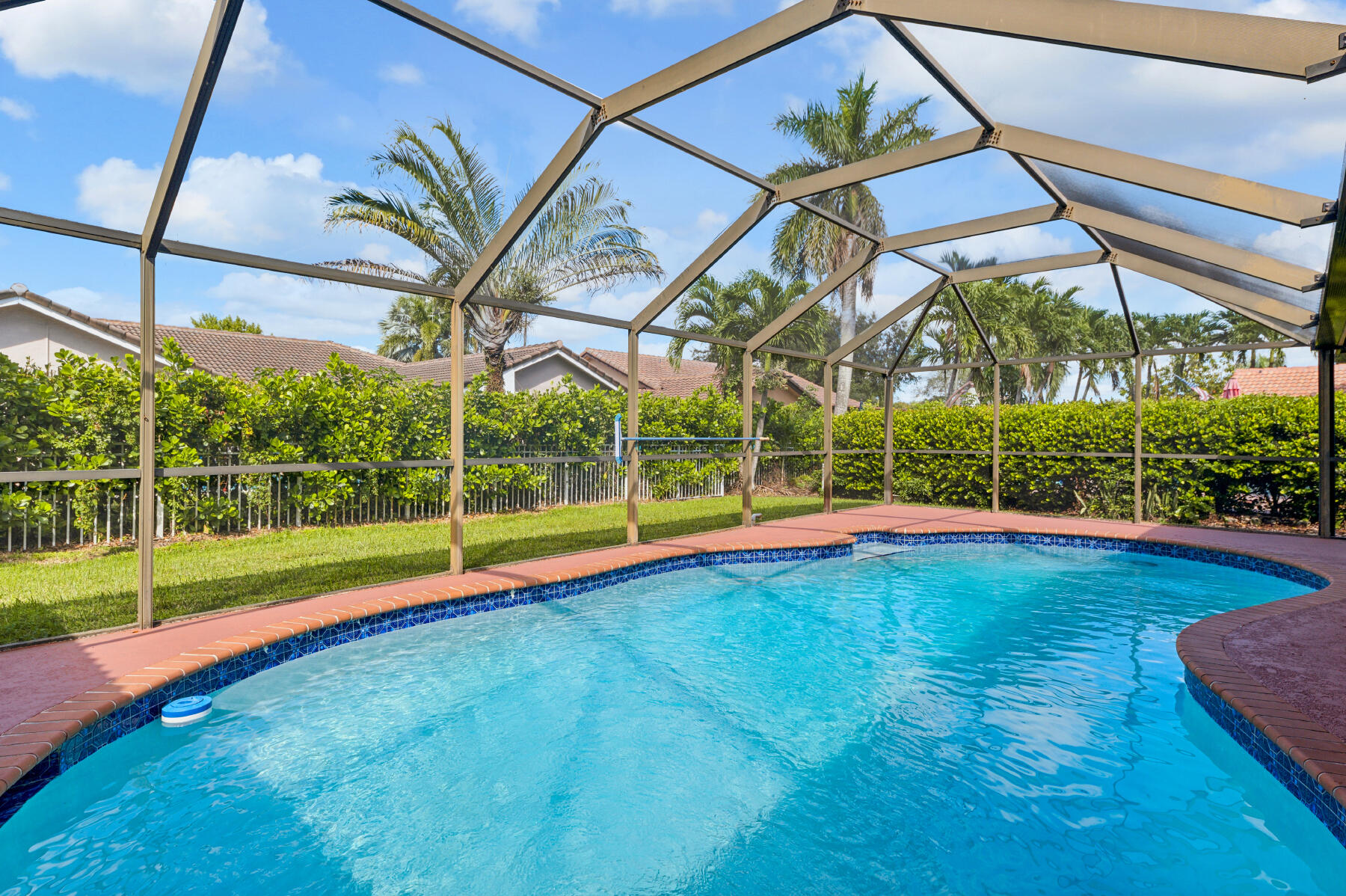 a view of a backyard with swimming pool