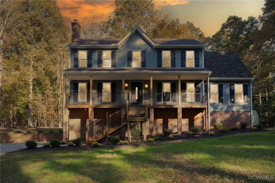 a view of a house with a yard and plants