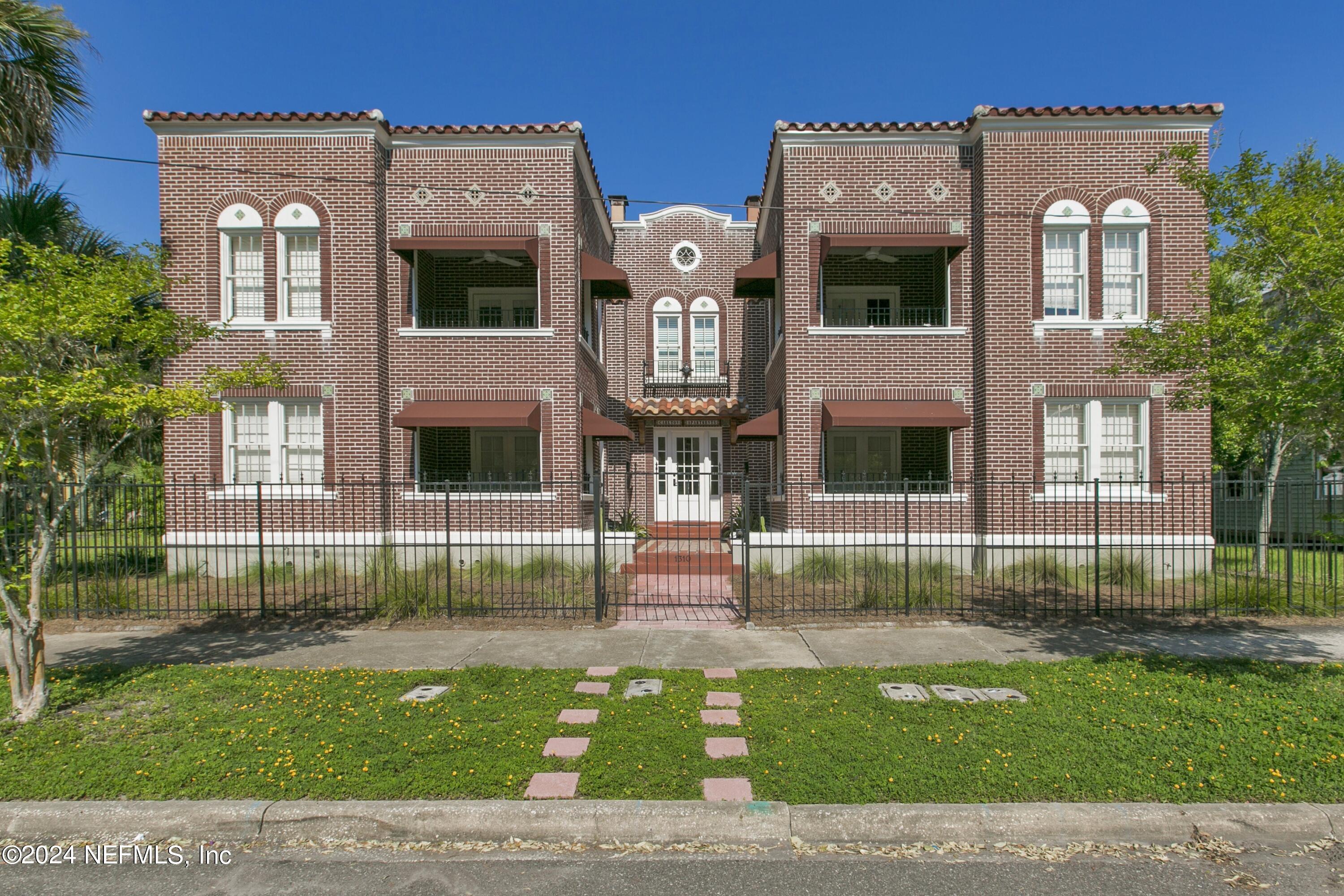 a view of a building with a garden