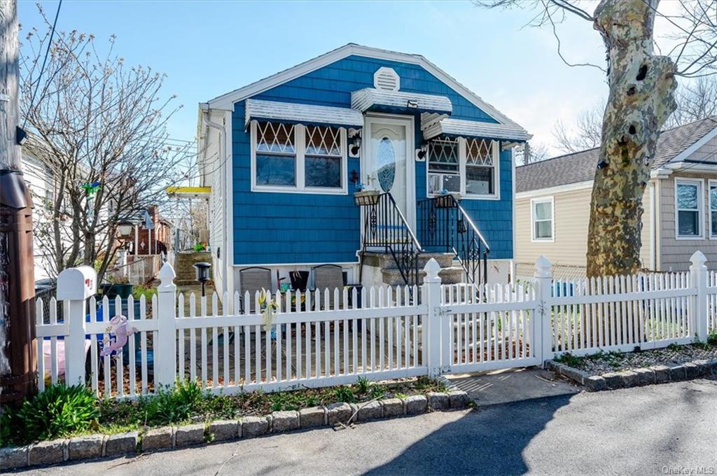 a front view of a house with a small yard