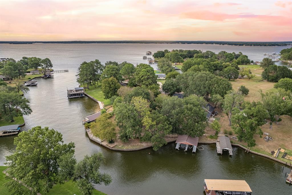 an aerial view of a house with a lake view