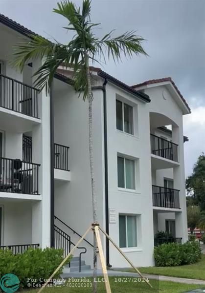 a front view of a house with balcony