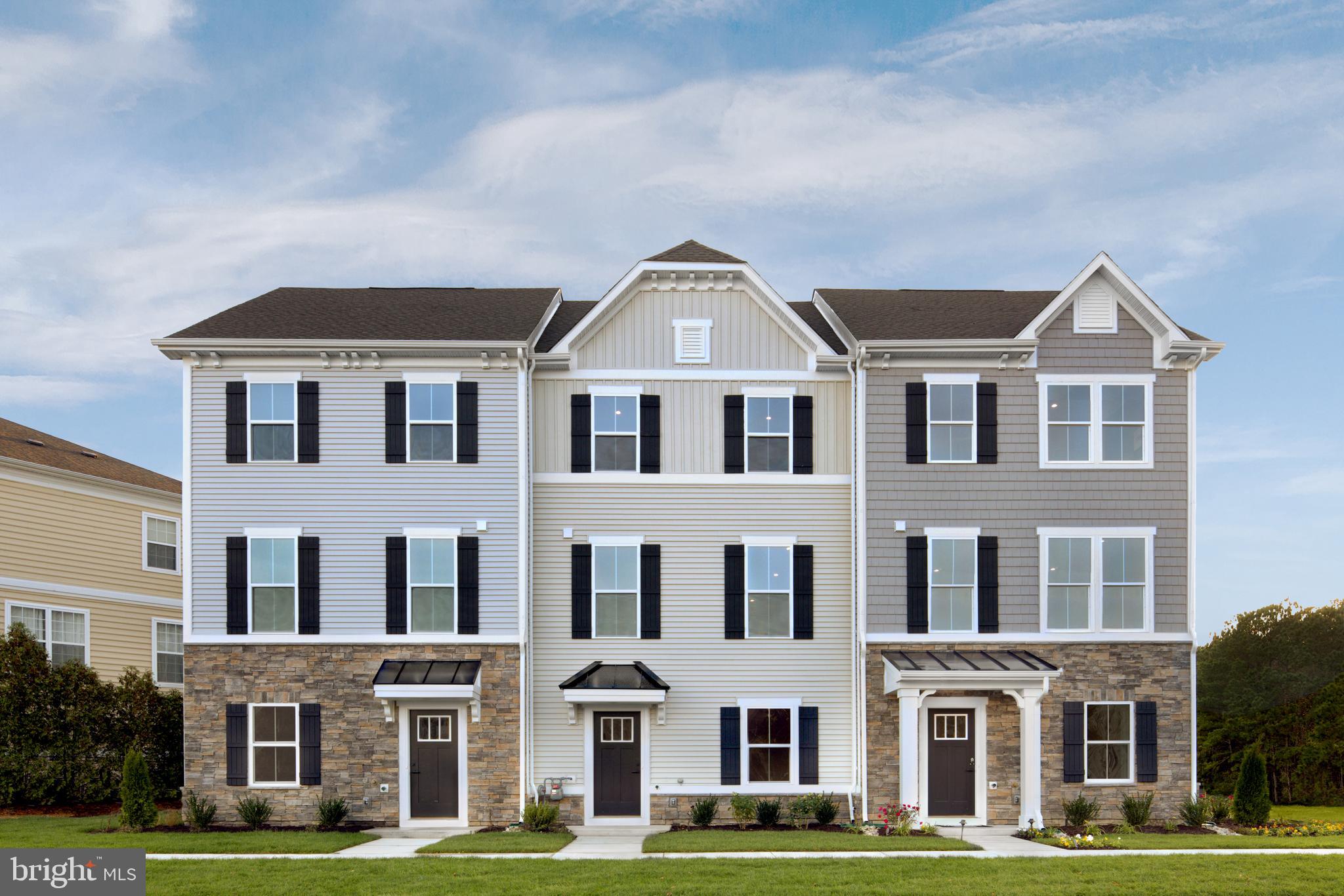 a front view of residential building with yard