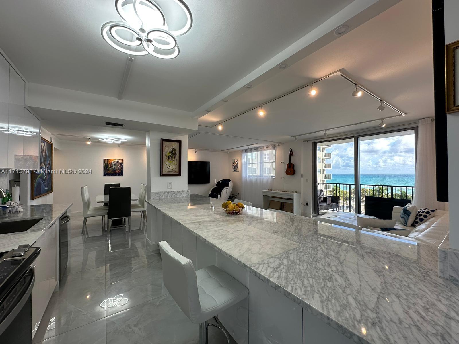 a large kitchen with a large window and counter space