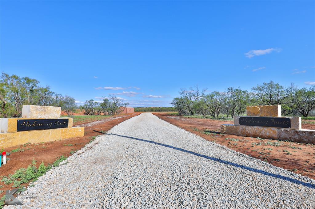 a view of a road with a building in the background